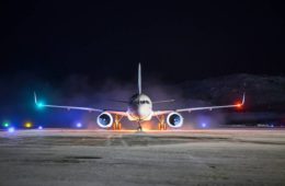 a plane on a runway at night