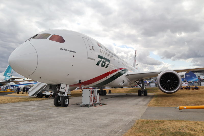 a white airplane on a runway