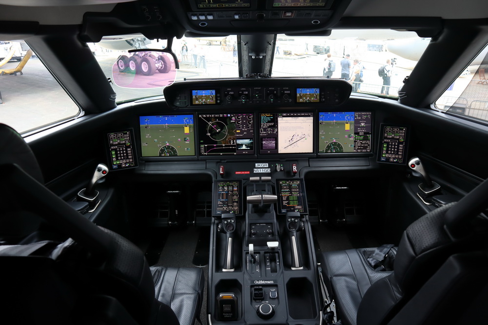 the inside of a cockpit with multiple screens