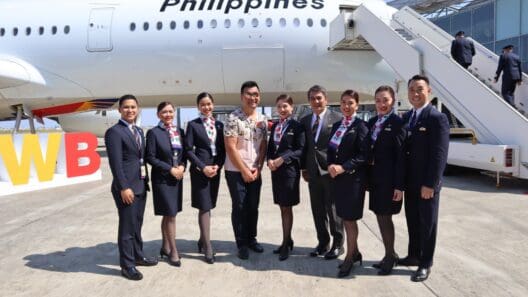 a group of people standing in front of an airplane