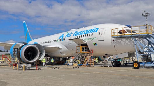 a large white airplane with blue letters on it