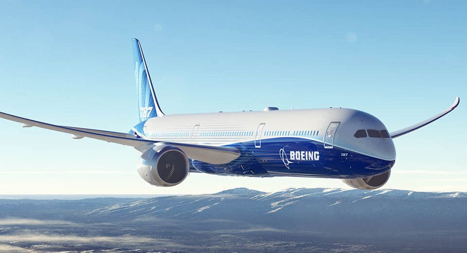 a plane flying over mountains