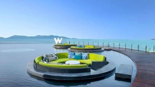 a pool with couches and a table