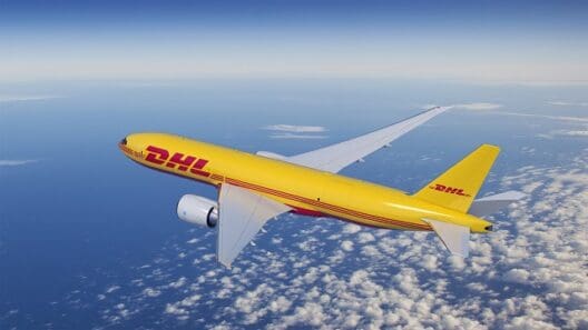 a yellow airplane flying in the sky