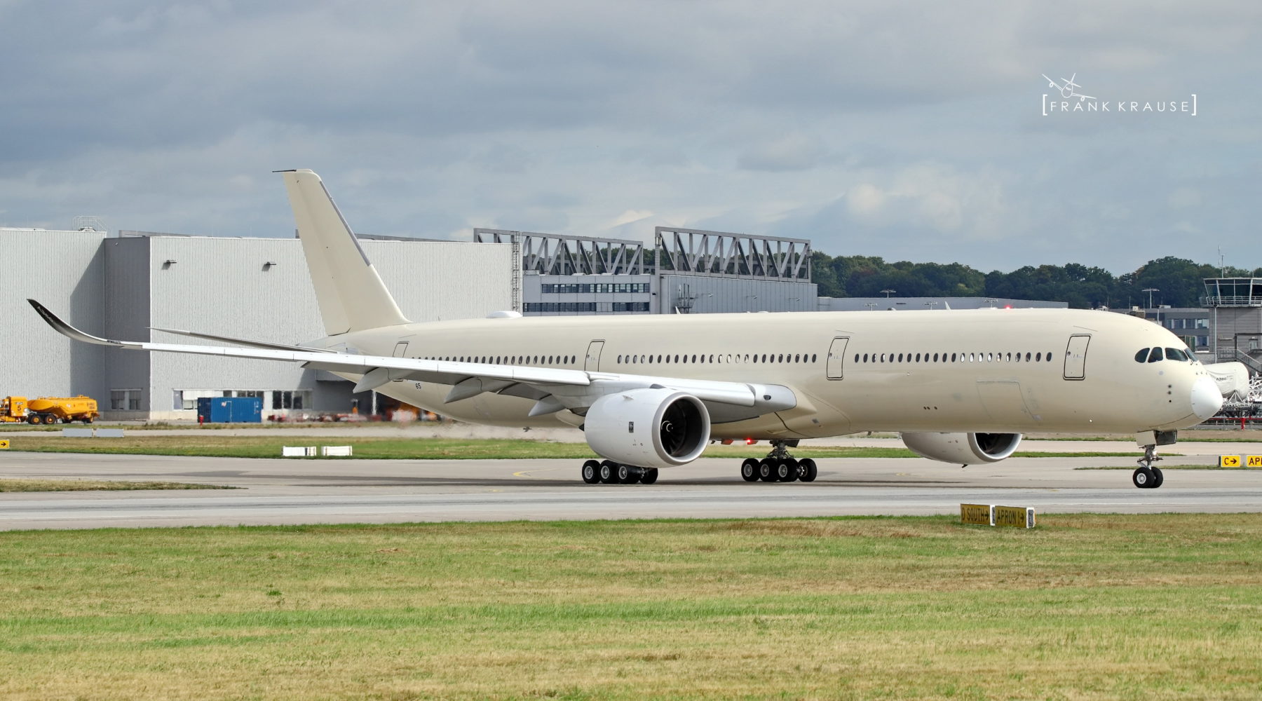 a large white airplane on a runway