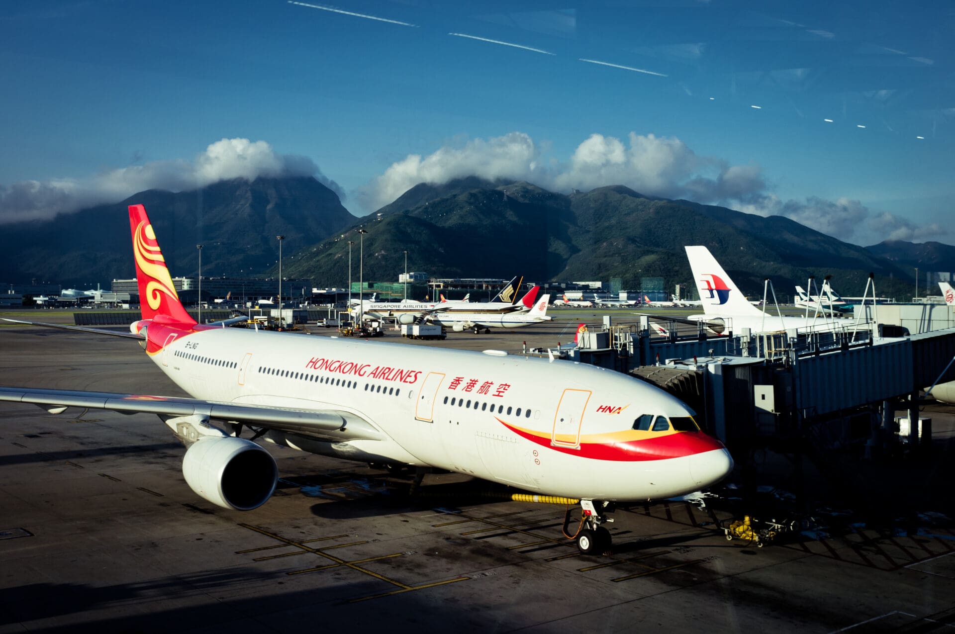 a large white airplane with red and yellow stripes on the side