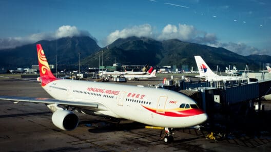 a large white airplane with red and yellow stripes on the side