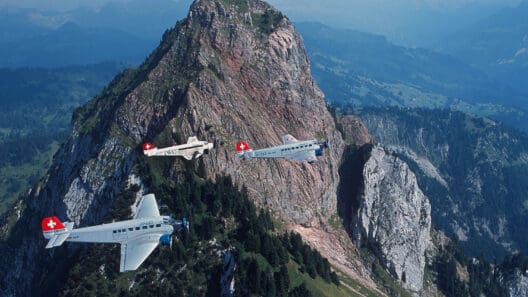 airplanes planes flying over a mountain