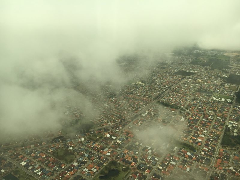 aerial view of a city with clouds