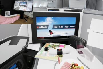 a screen and computer on a plane