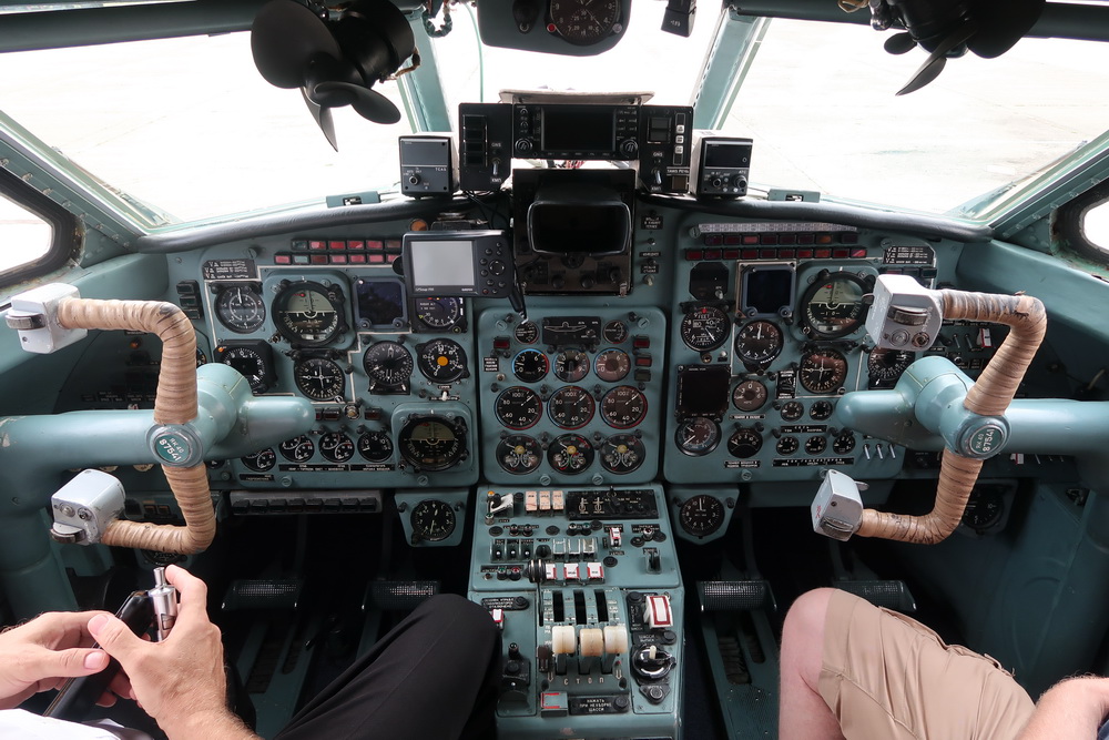 a person in the cockpit of a plane