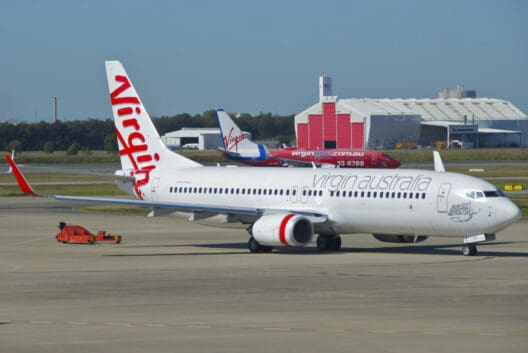a white airplane on the runway
