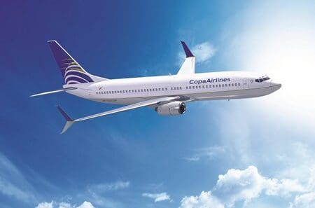 a white airplane flying in the sky