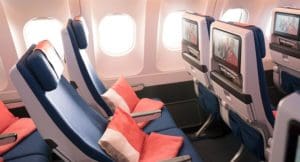 seats in an airplane with a television screen