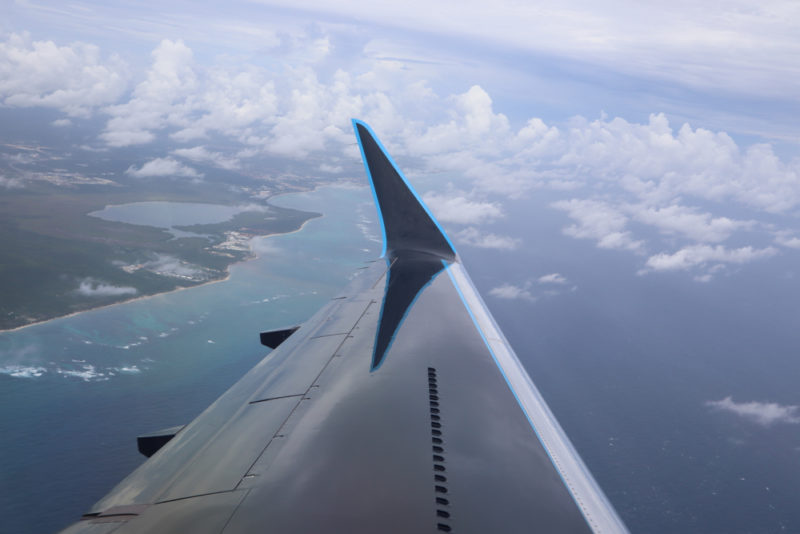 an airplane wing in the sky