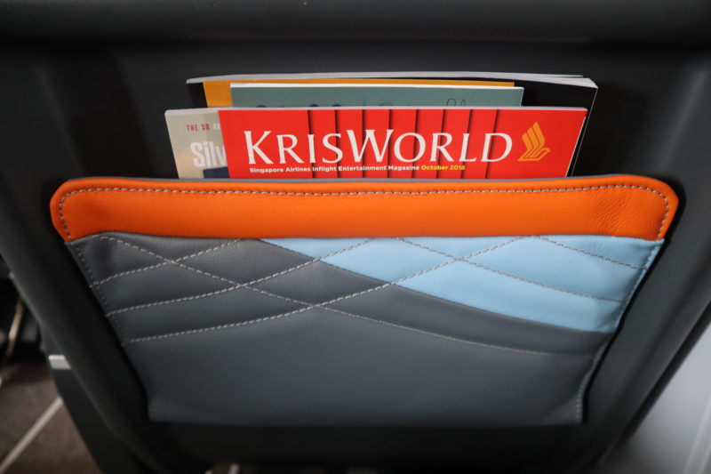 a group of books in a pocket of a car