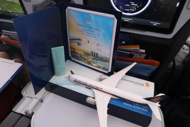 a model airplane and a picture on a table