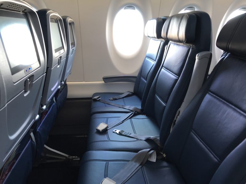 seats in an airplane with a window