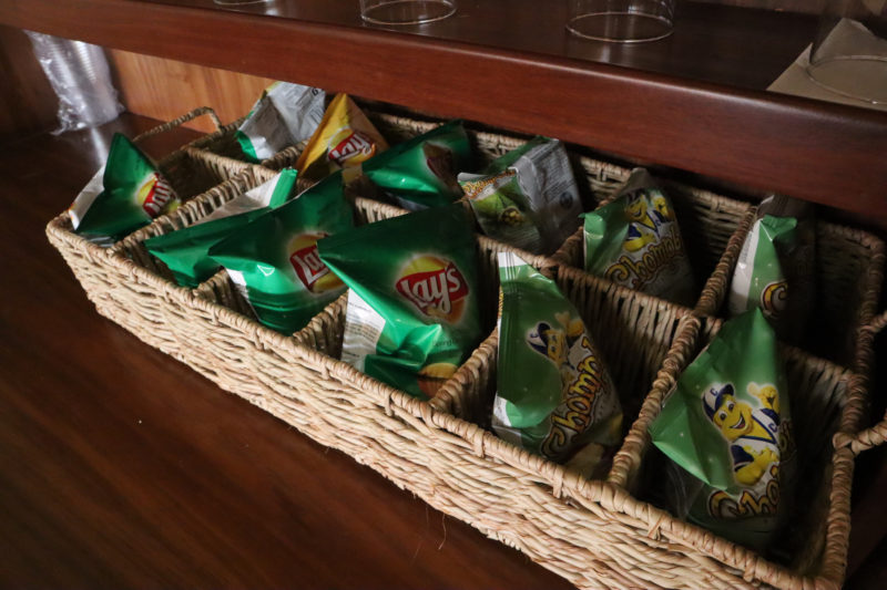 a basket of chips in a wooden shelf