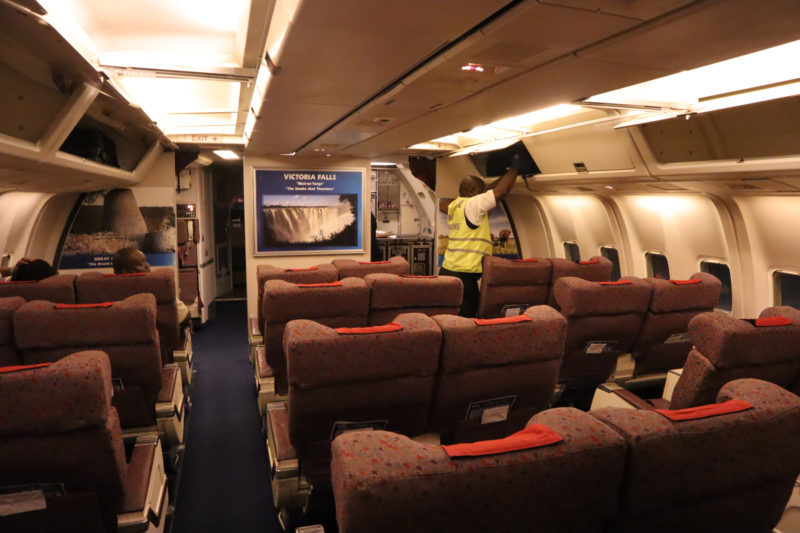 a man standing in an airplane