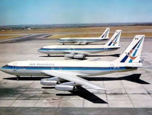 a group of airplanes on a runway