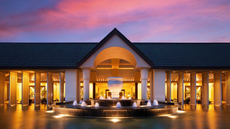 a building with a fountain in front of it