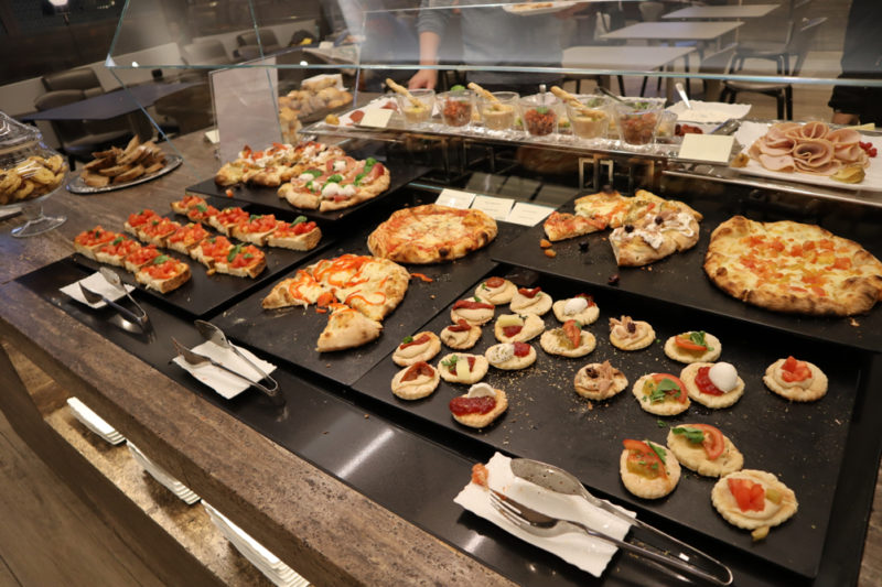 a display of pizzas on a counter