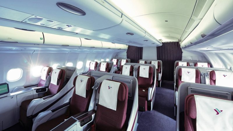 a plane with seats and a curtain