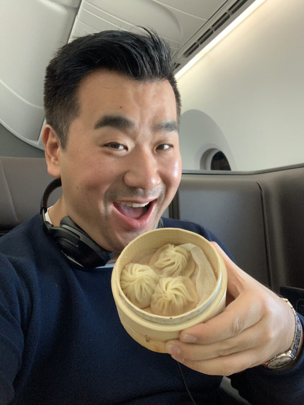 a man holding a container of food