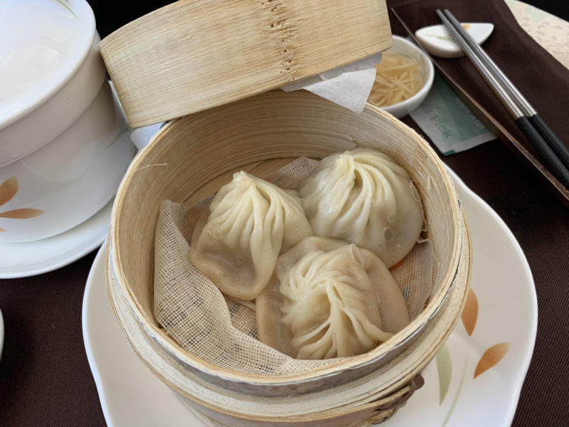 a basket of dumplings on a plate