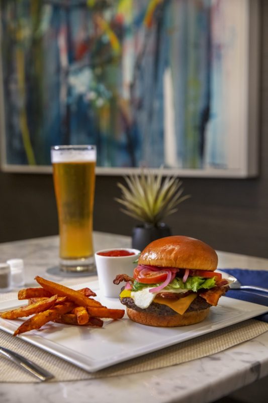 a burger and fries on a plate