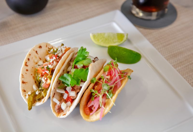 a plate of tacos on a table