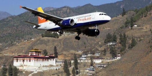 a plane flying over a town