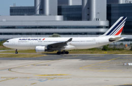 a large white airplane on a runway