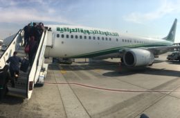 a group of people boarding an airplane