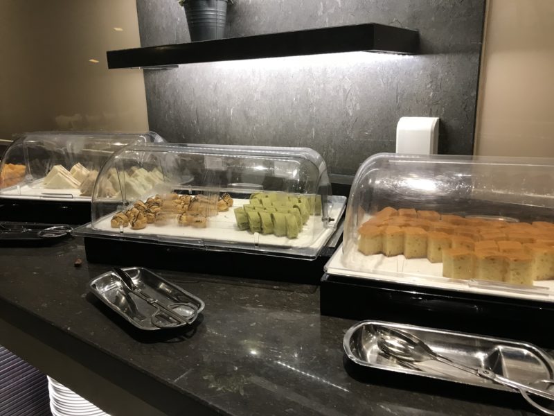 a trays of food on a counter