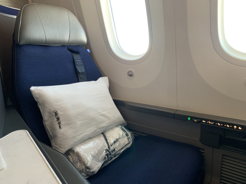 a pillow on a seat in a plane