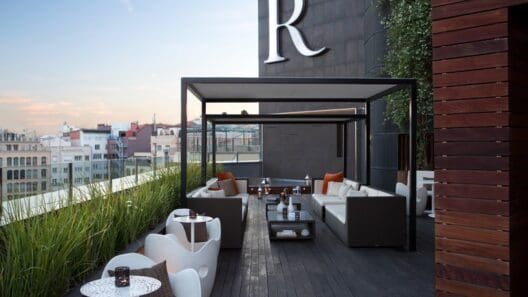 a patio with a large white and brown outdoor furniture