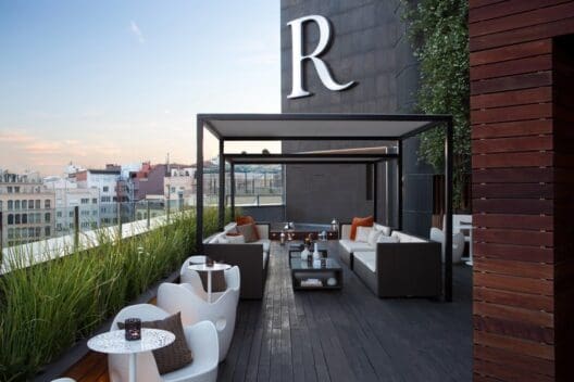 a patio with a large white and brown outdoor furniture