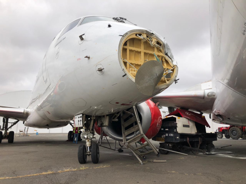 an airplane with a broken nose