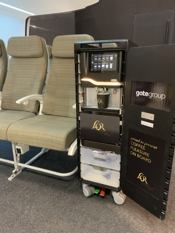 The airline trolley with coffee vending machine installed.