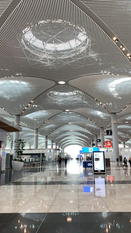 New Istanbul Airport with flags of Turkey shaped roof lighting.