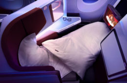 a bed and pillows in a plane