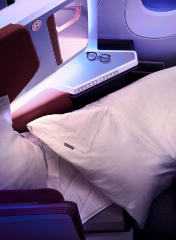 a bed and pillows in a plane