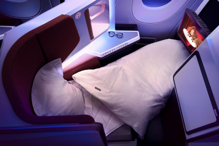 a bed and pillows in a plane