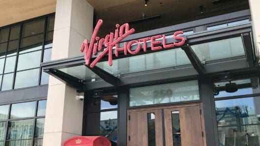 a man walking in front of a hotel