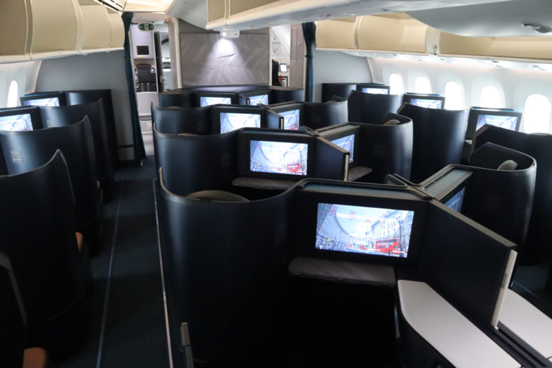 a row of monitors in an airplane