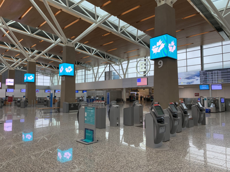 an airport terminal with electronic devices