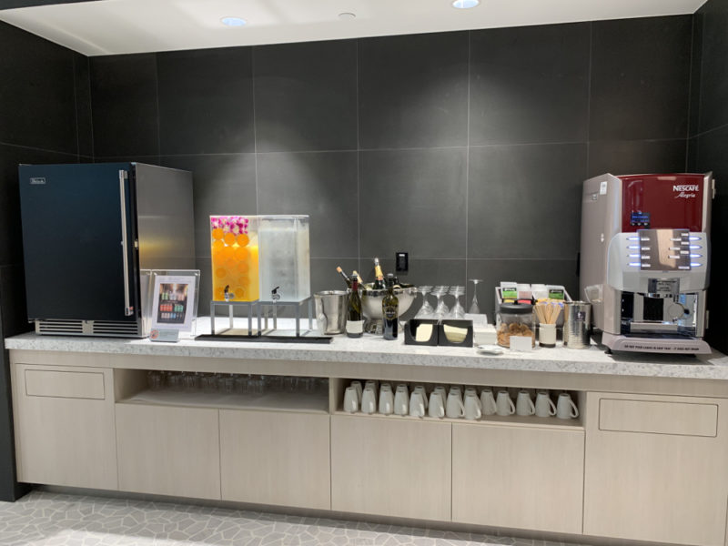 a counter with drinks and beverages on it