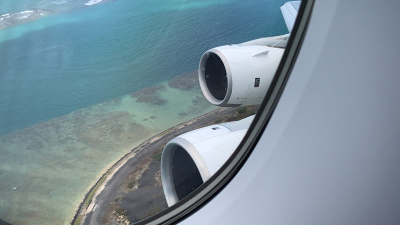 a view of the ocean from a window of an airplane